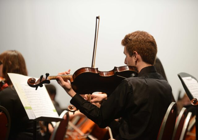 Music student playing violin in the Instrumental Music minor at HPU's Hayworth School of Arts and Design