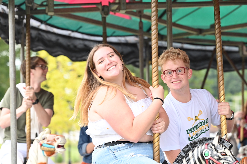 students on merry go round