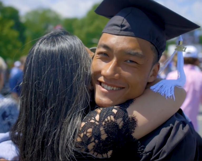 HPU Student Parent Hug Embrace at Commencement