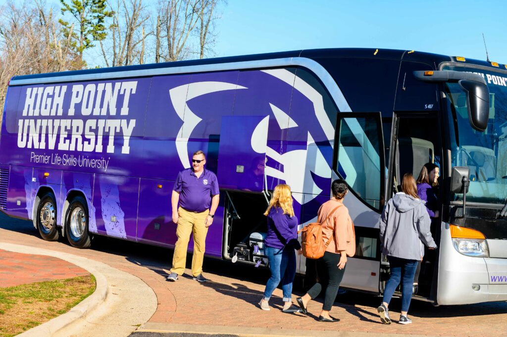 Students embarking on a HPU Bus