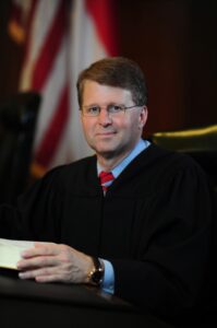 Official portrait of former Chief Justice Mark D. Martin.