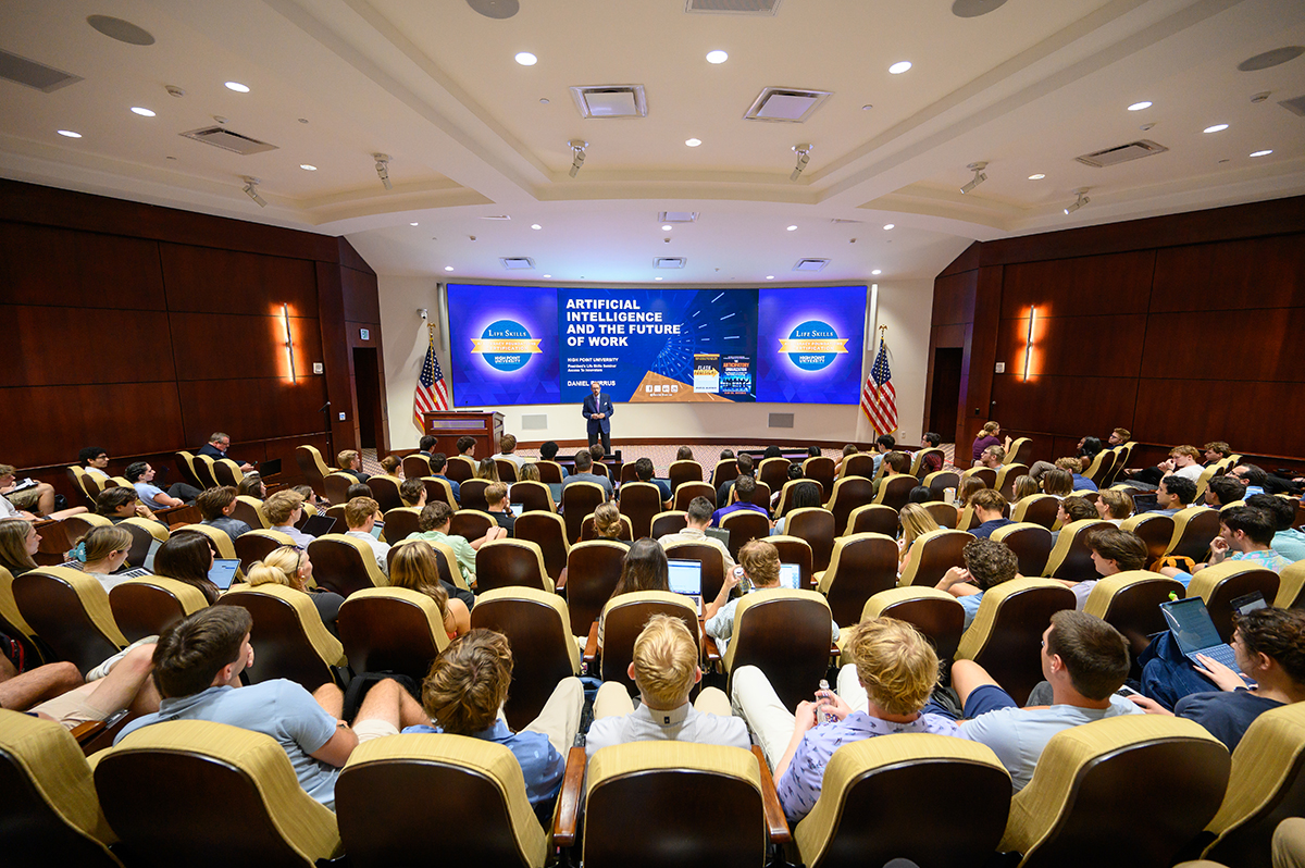 Burrus shared his views on AI while speaking to a large audience of students in the Callicutt Life Skills Theater. His talk was part of HPU’s Life Skills certification program, in which students can earn a tuition-free microcredential in AI Literacy Foundations.