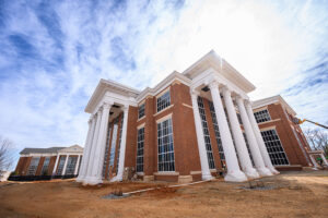The dental school building is similar in design and identical in size to the law school building at three stories and 77,500 square feet.