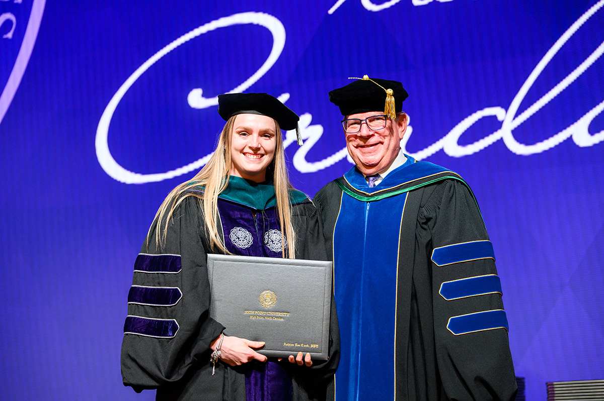 Dr. Ashton Cook, a member of the DPT Class of 2025, earned a spot into a residency program at the University of Kentucky HealthCare in Lexington, Kentucky. She accepted her diploma from HPU Provost Daniel Erb at her graduation.