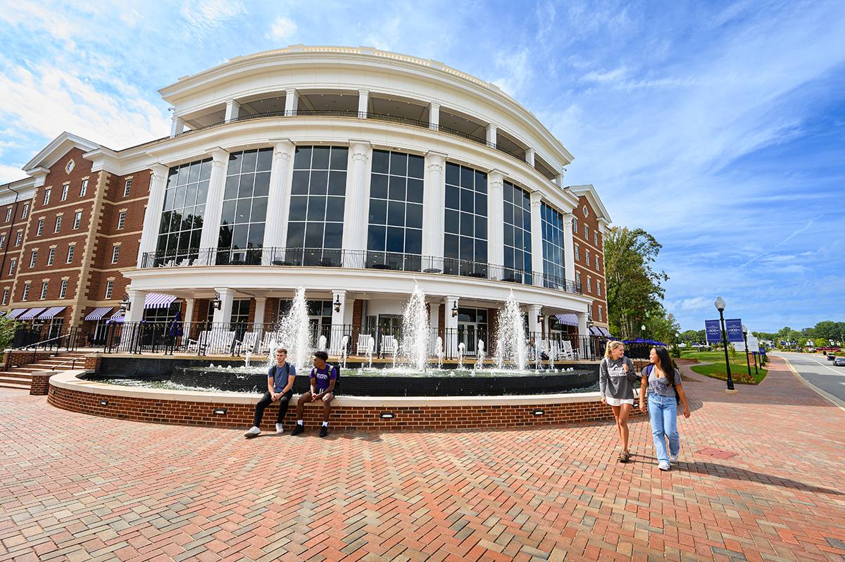 HPU students have the option to live in Panther Commons, which is the university’s newest residence hall. Students gathered outside the five-story, 200,000-square-foot building during a sunny day.