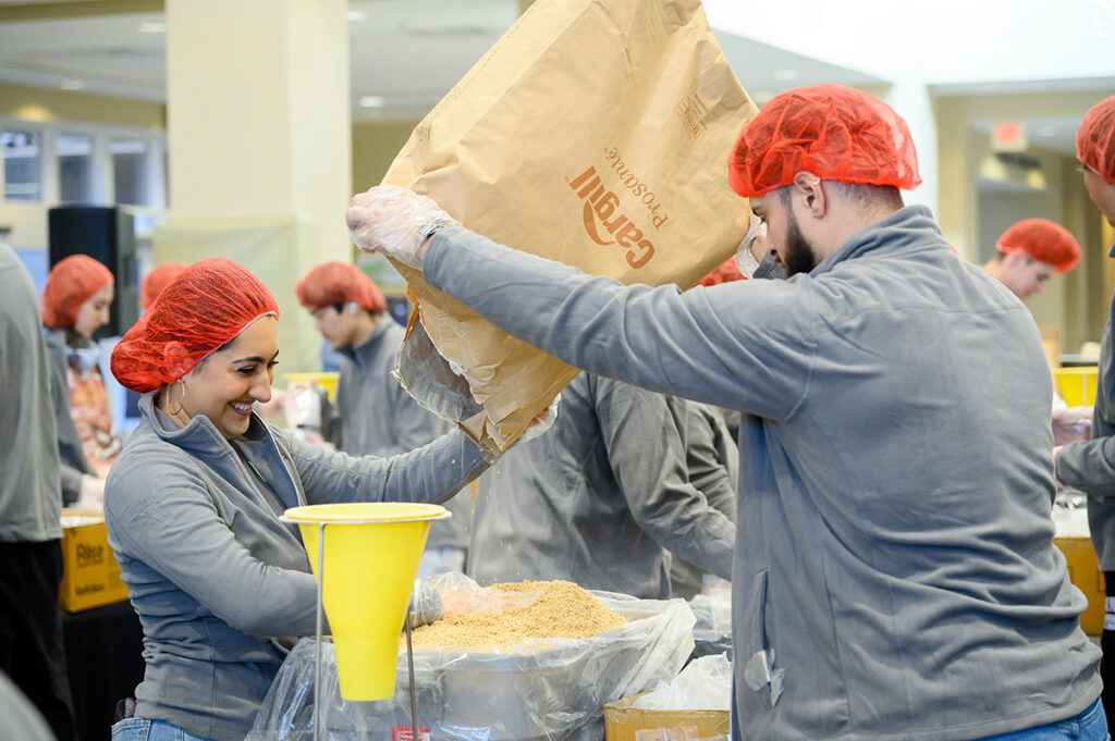 More than 400 students formed assembly lines inside HPU’s Slane Student Center as they packed 80,000 meals for people who are struggling with food insecurity.
