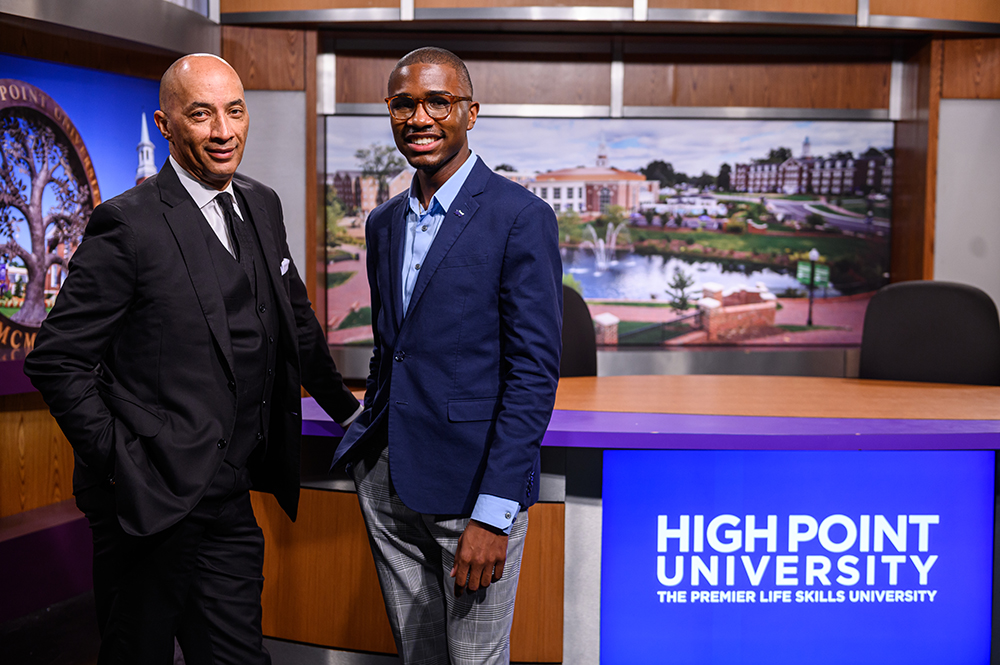 Grant Hines, who graduated from HPU’s tuition-free Master of Arts in Communication and Business Leadership program in 2024, was mentored by Byron Pitts, co-anchor of ABC News’ “Nightline” and HPU’s Journalist in Residence. Pictured from left are Pitts and Hines in a TV studio on HPU’s campus.
