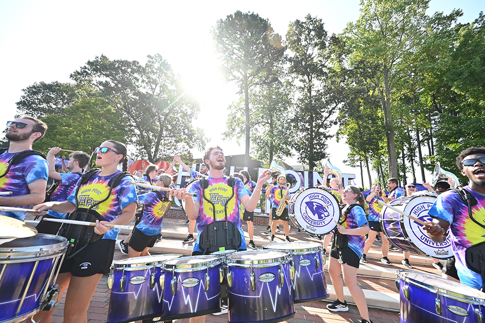 The HPU Marching Panthers band performed for the Class of 2029 in front of an “I Love High Point University” sign on campus.