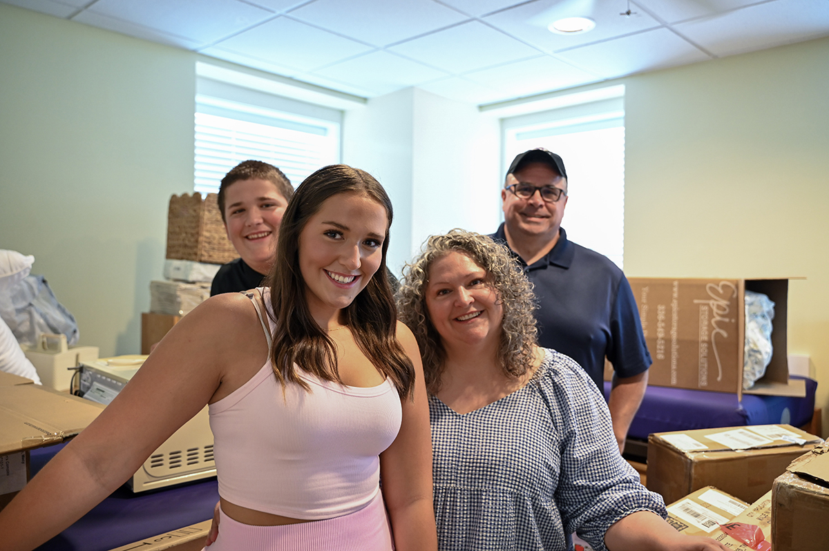 Macy Nelson, an interior design major from South Bend, Washington, posed with brother William and parents Amy and Jason Nelson.