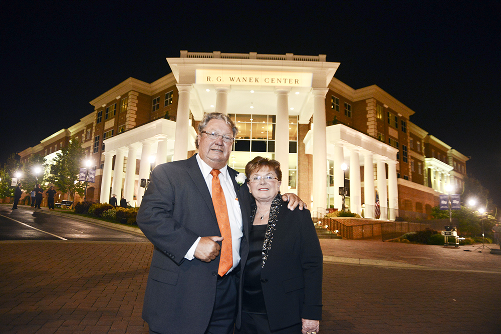 High Point University supporters Ron and Joyce Wanek standing outside the RG Wanek Center on campus.