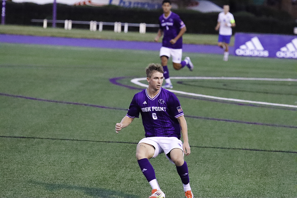 A High Point University men's soccer player in a game during the 2025 season.