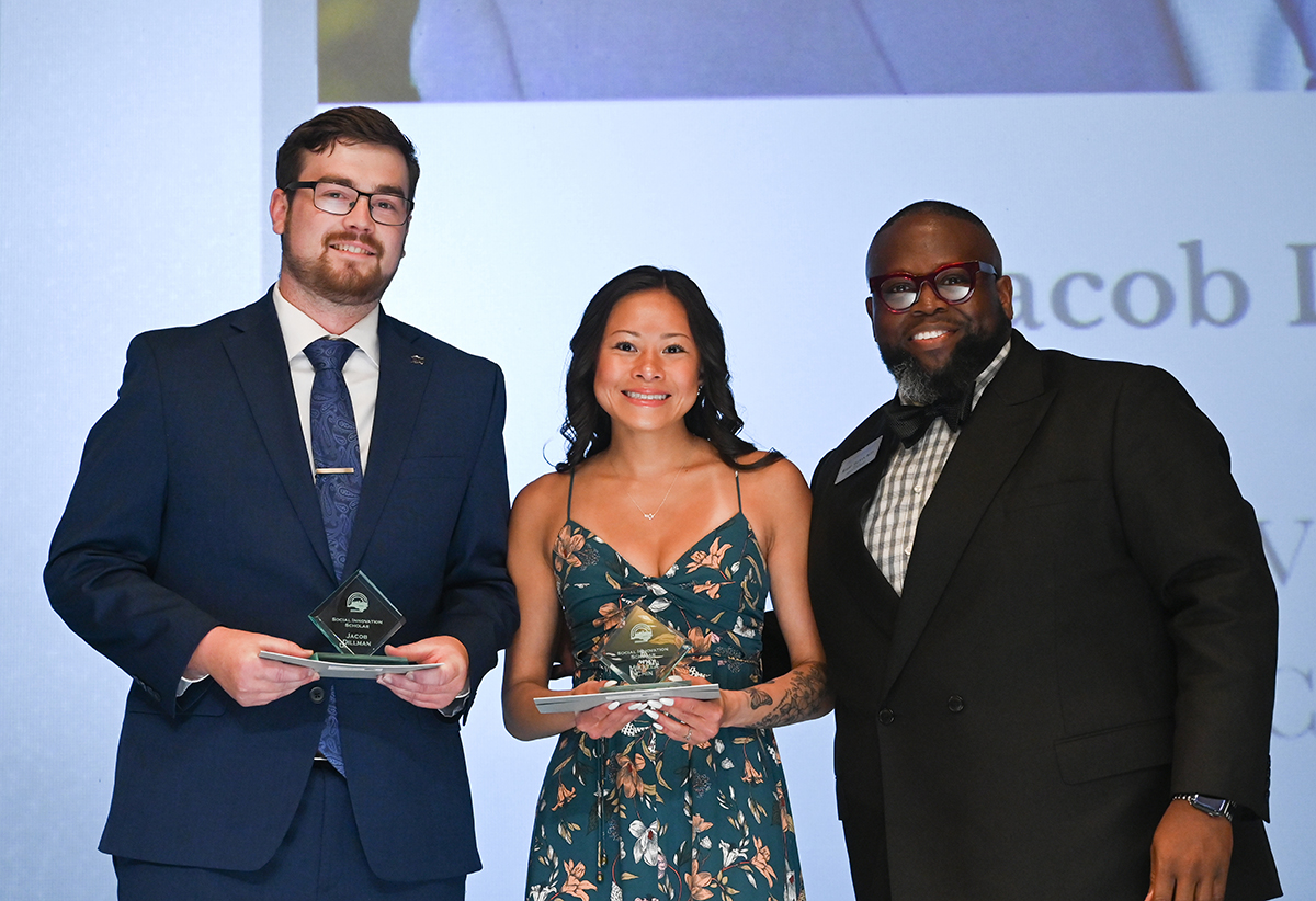 From left, Jacob Dillman and Mikaela Chin with Social Innovator Scholar awards, presented by Robert Tillman, director of the Bonner Leaders program.