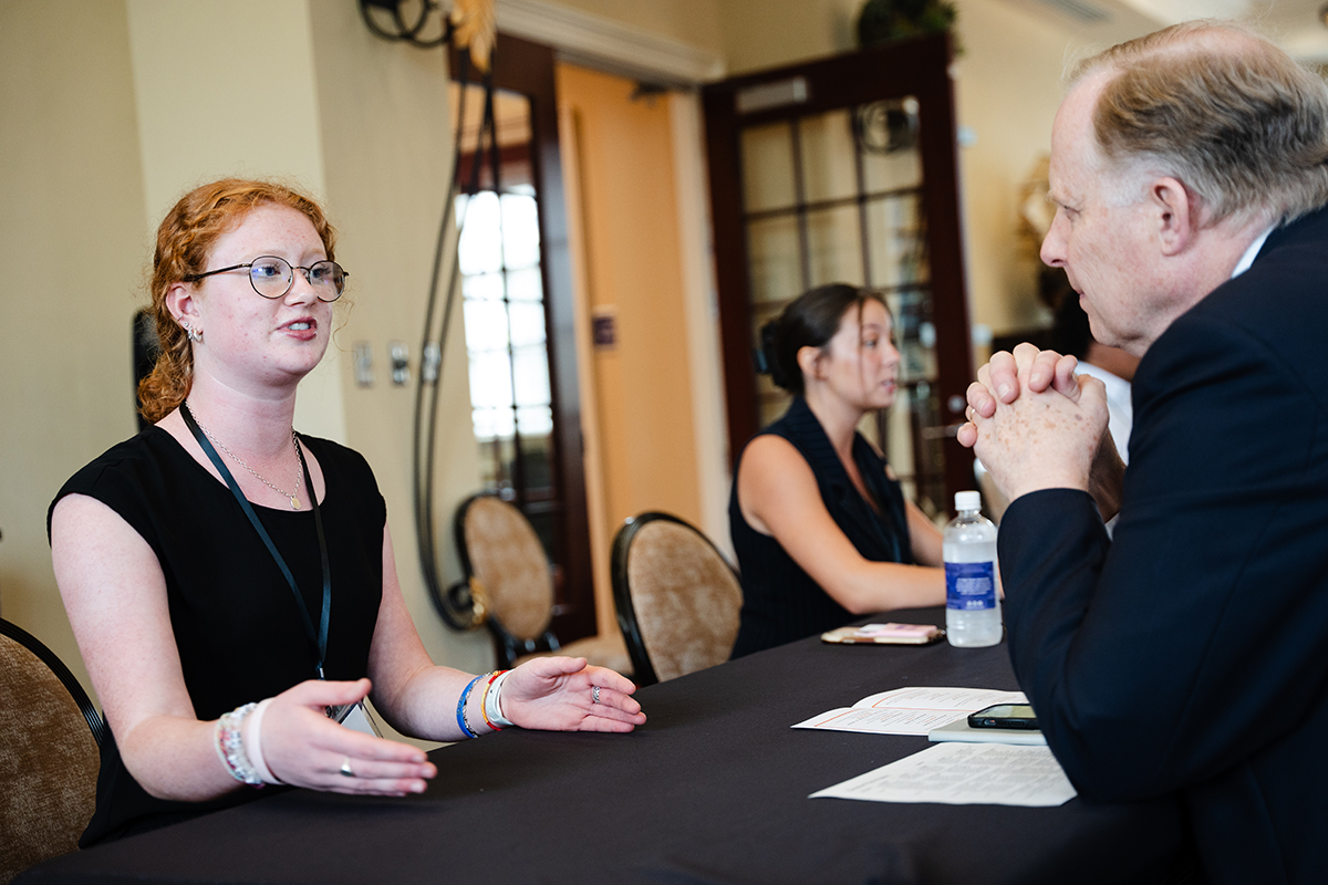 Taylor Galavotti, a senior neuroscience and English double major from Lexington, Kentucky, shared her research with Andrew Modlin, senior associate vice president for graduate admissions, during her elevator pitch.