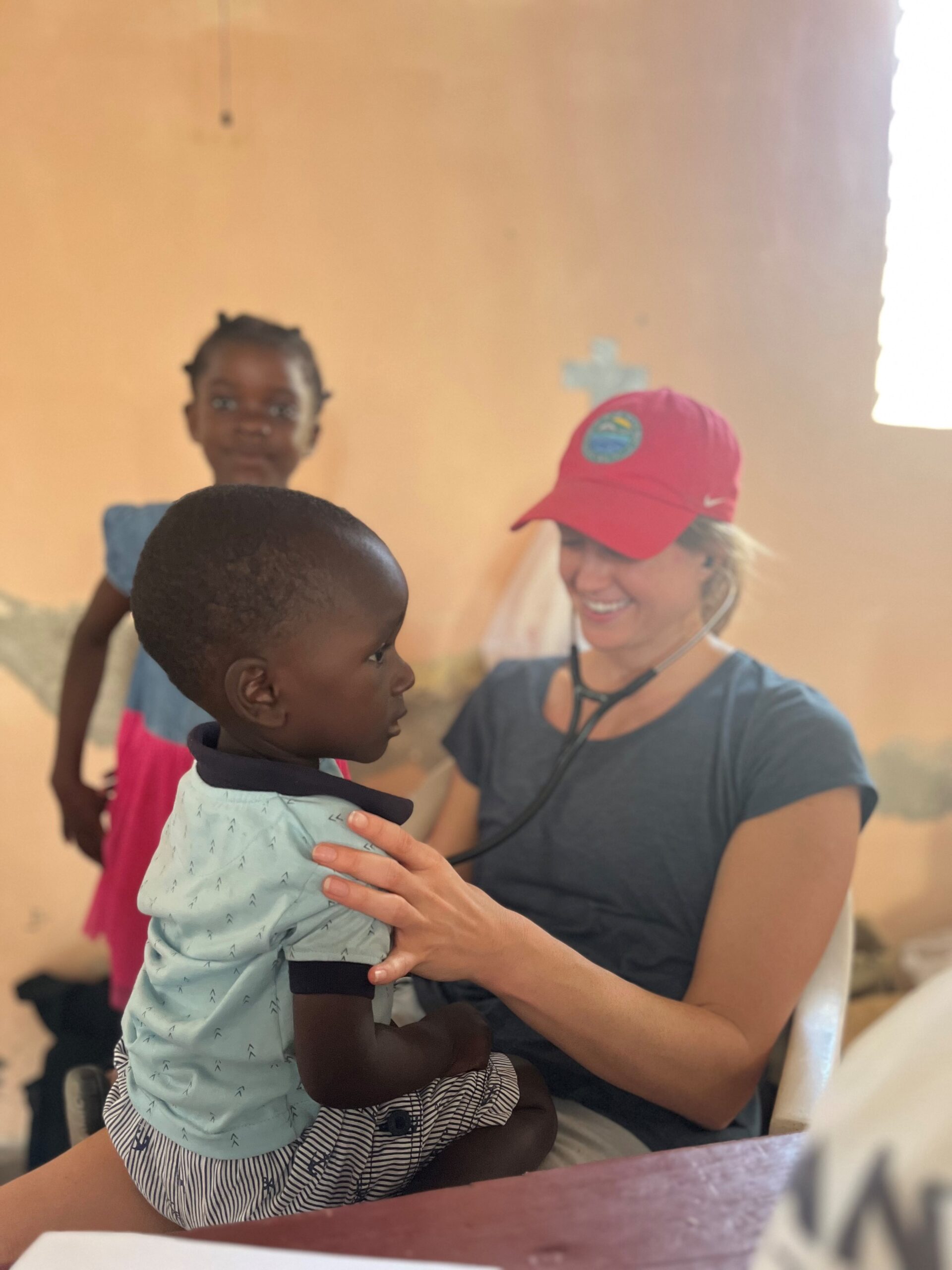 Dr. Mallary Clay, one of the inaugural graduates of High Point University’s Doctor of Medical Sciences program, smiled as she checked a boy’s vitals during a mission trip.