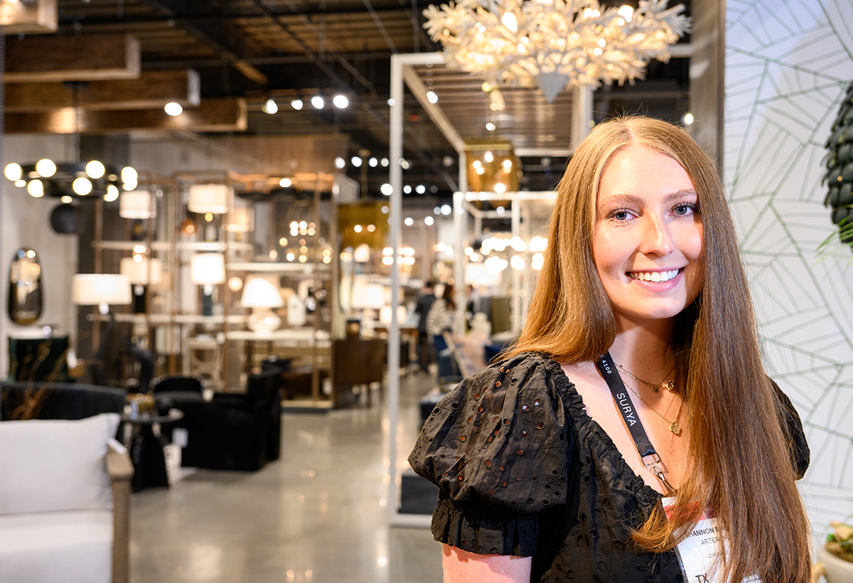 Shannon Spilman, a senior interior design major from Hunt Valley, Maryland, toured customers through the Arteriors showroom.