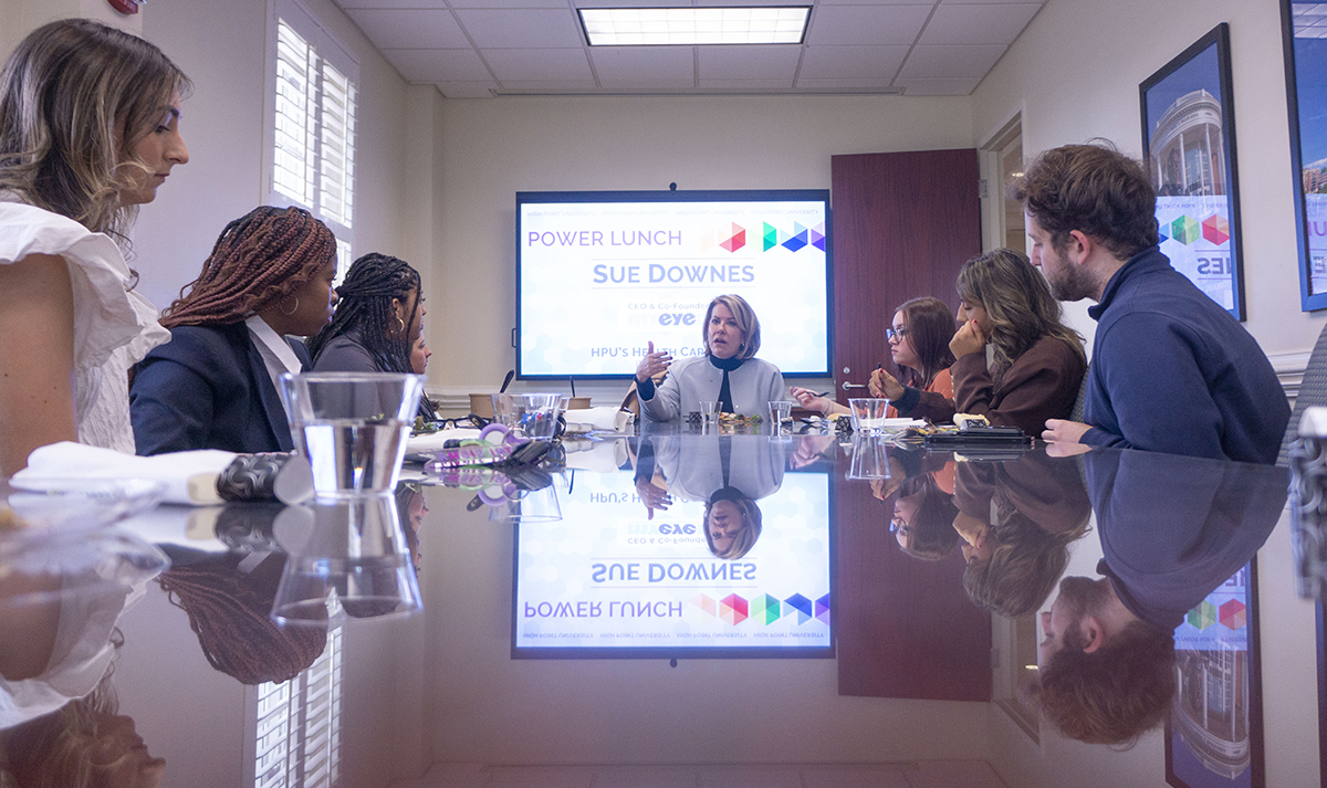 Downes, center, shared lunch with students. 