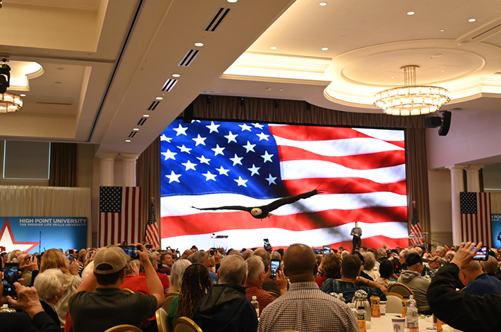 More than 2,000 people attended High Point University’s 13th Annual Veterans Day Celebration at the Nido and Mariana Qubein Arena and Conference Center on Nov. 10, 2023. The program included Clark, a bald eagle that soared above the audience as the HPU Chamber Singers sang “America the Beautiful.”