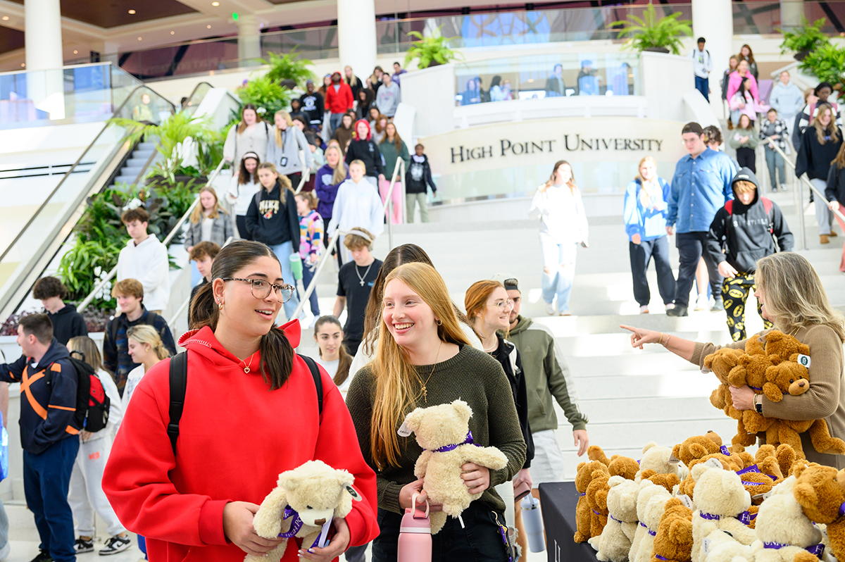 Students chatted after getting a teddy bear inside the Nido and Mariana Qubein Center.