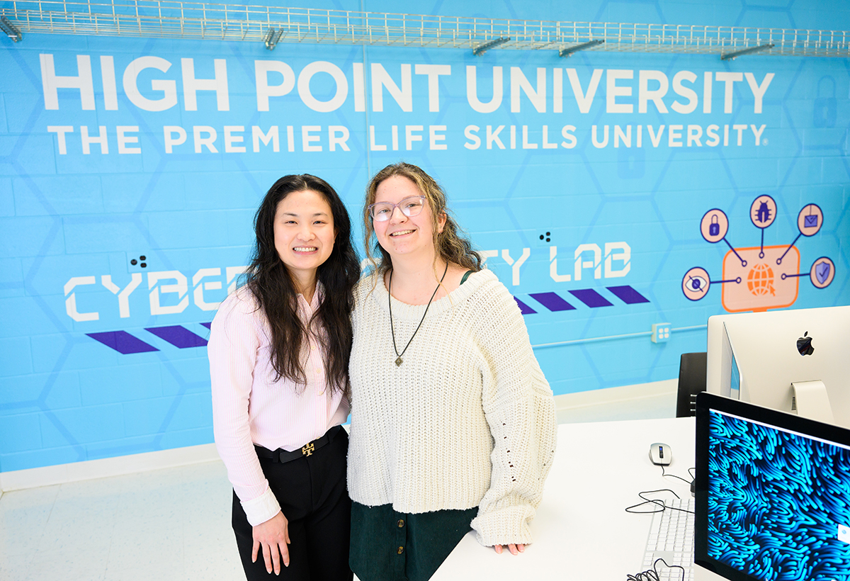 Pictured from left are Ky Nguyen, a senior data science major from High Point who placed third at the Mid-Southeast Regional Conference for her paper presentation, with Alexa Dandrea, a senior dual major in computer science and mathematics who placed second for her poster presentation.