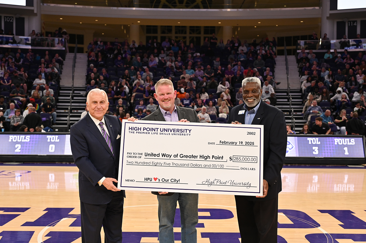 High Point University raised a record $285,000 for United Way of Greater High Point. HPU President Nido Qubein presented a check for $285,000 to United Way of Greater High Point Campaign Chair Adam Hoover and Joe Barnes, the nonprofit organization’s vice president of resource development, during the HPU men’s basketball game in the Nido and Mariana Qubein Arena and Conference Center on Feb. 26.
