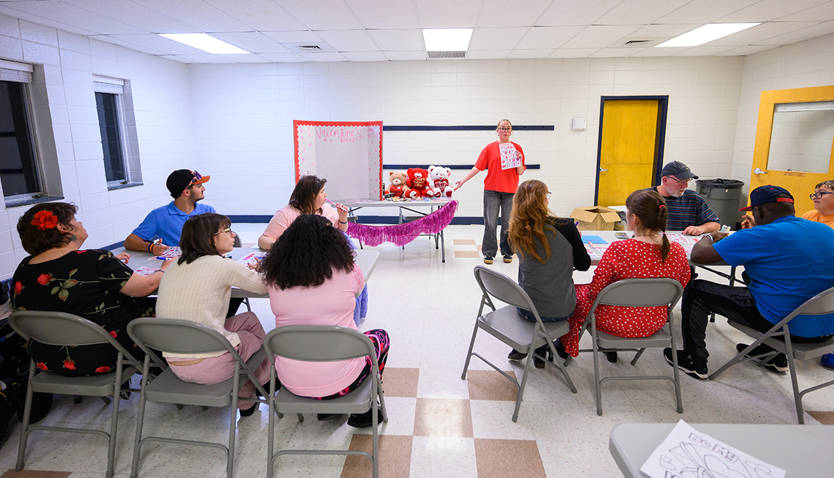 CEC Co-President Kaitlyn Townsley, a senior special education adapted curriculum major from High Point, explained the Valentine’s bingo game she created with visual images and showed prizes to participants.