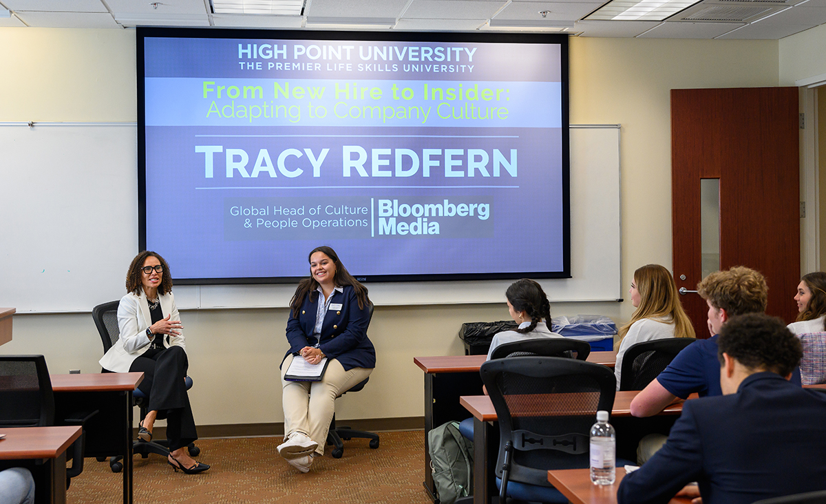 Redfern, left, taught about company culture in a class moderated by Liv Penteado, a Business Fellow in the Phillips School of Business.