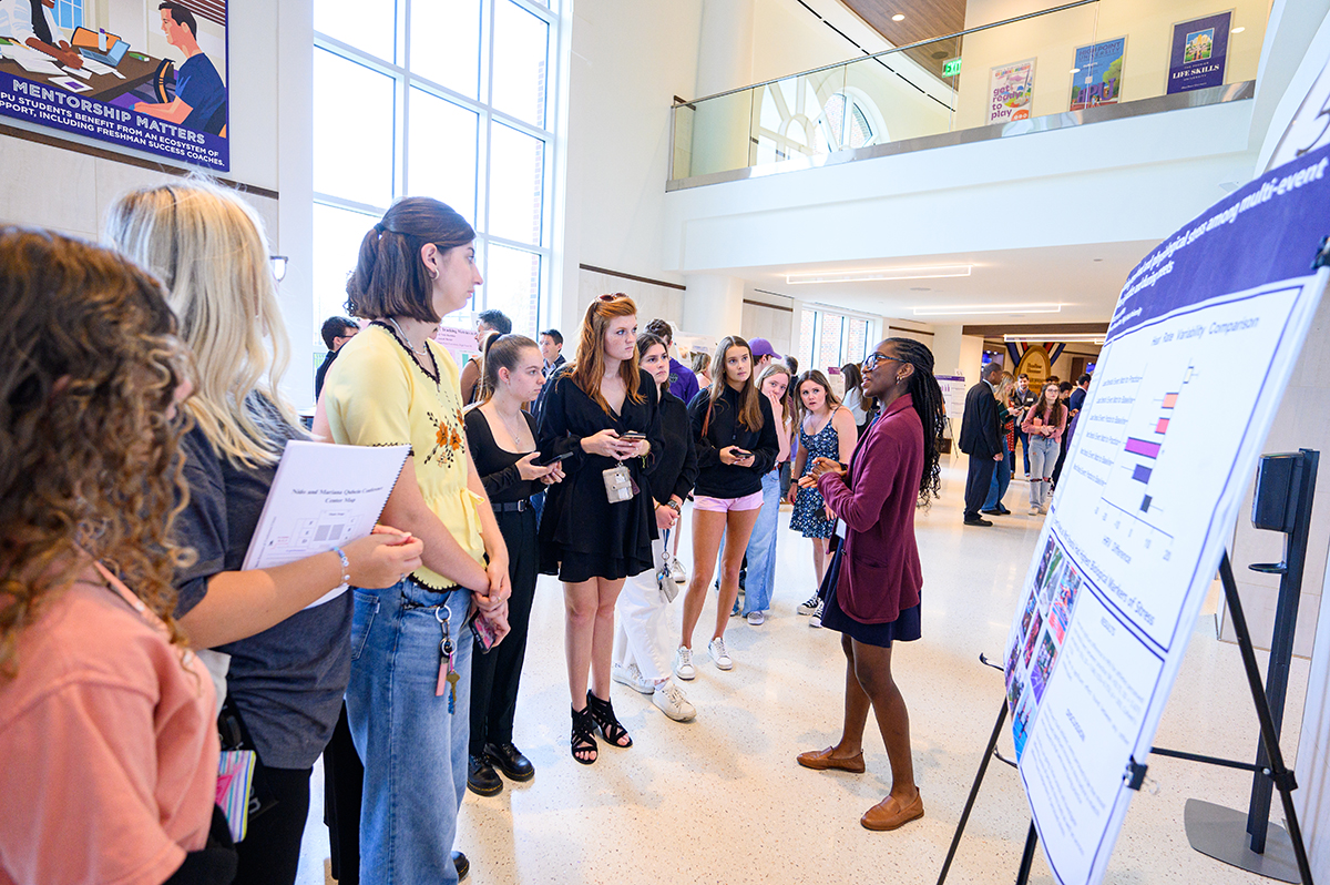 Fellow students listened attentively as Faith Bradley, a sophomore behavioral neuroscience major with double minors in sport management and musical theater, presented her research examining stress among multi-event athletes. 