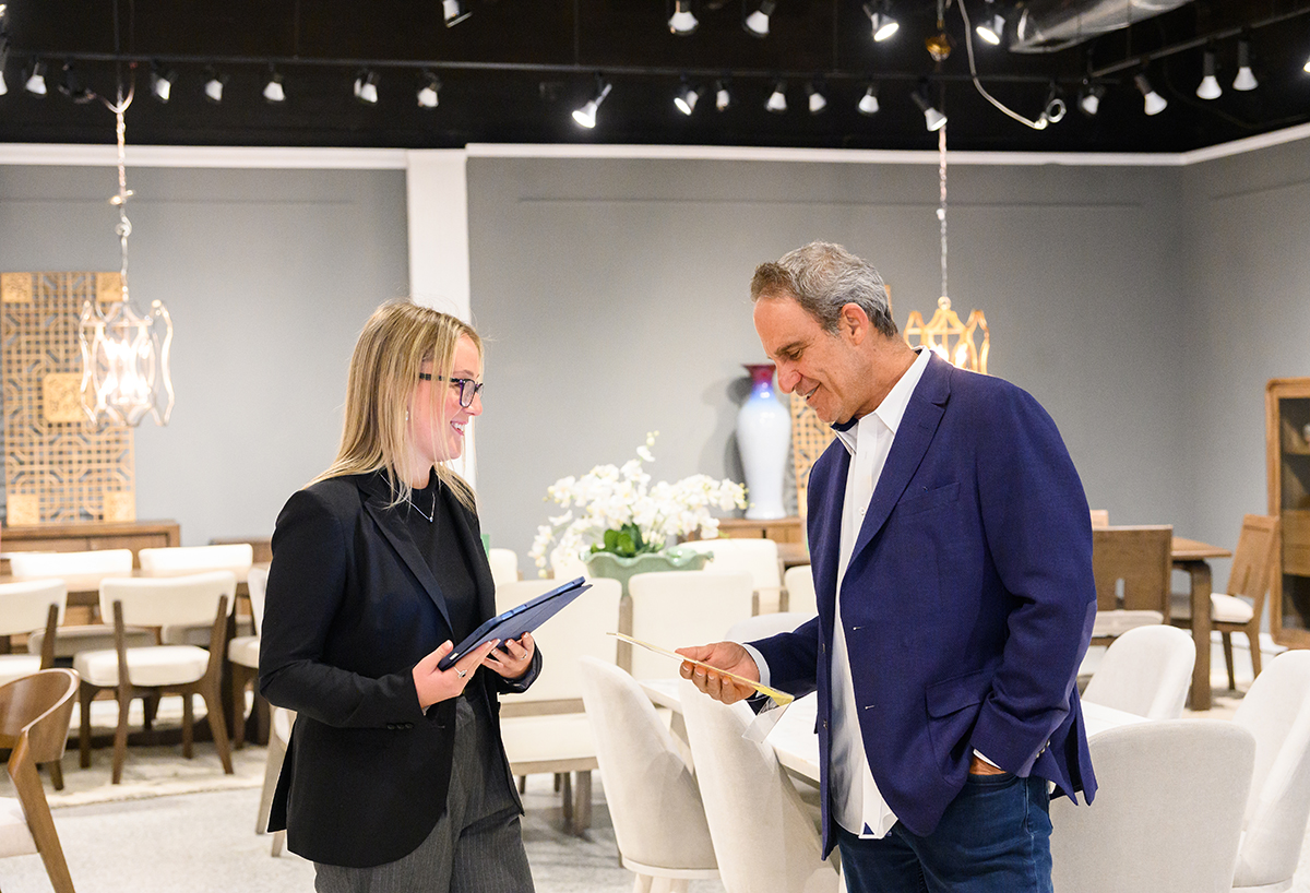 HPU student Kaitlyn Townsley, left, worked for a fourth consecutive market at Lifestyle Enterprise with Adam Leifer, the key account sales representative she assisted.