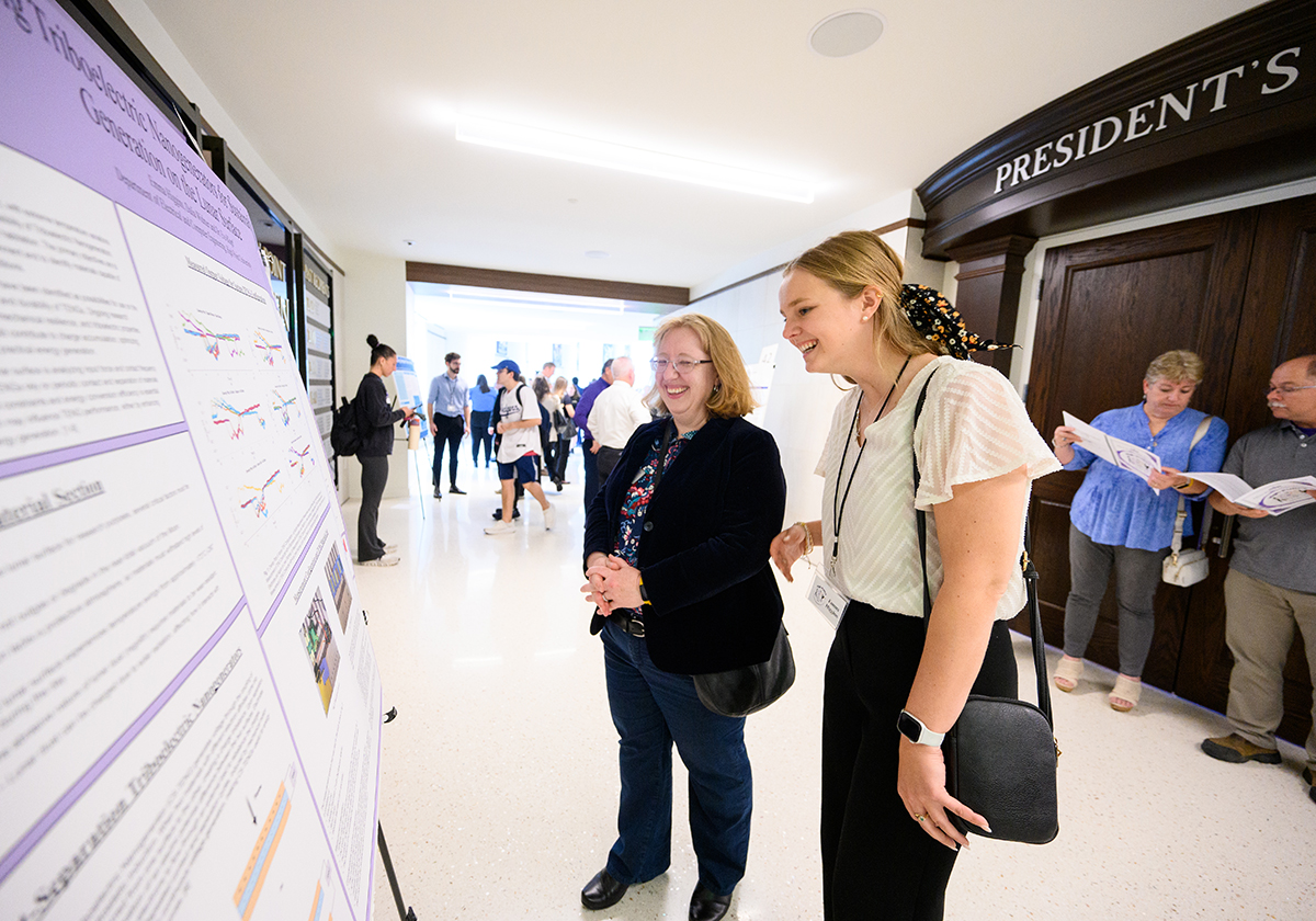 Eve Klopf, associate professor of electrical and computer engineering, laughed while discussing lunar research with Emma Higgins, a senior electrical engineering major from Yonkers, New York. 