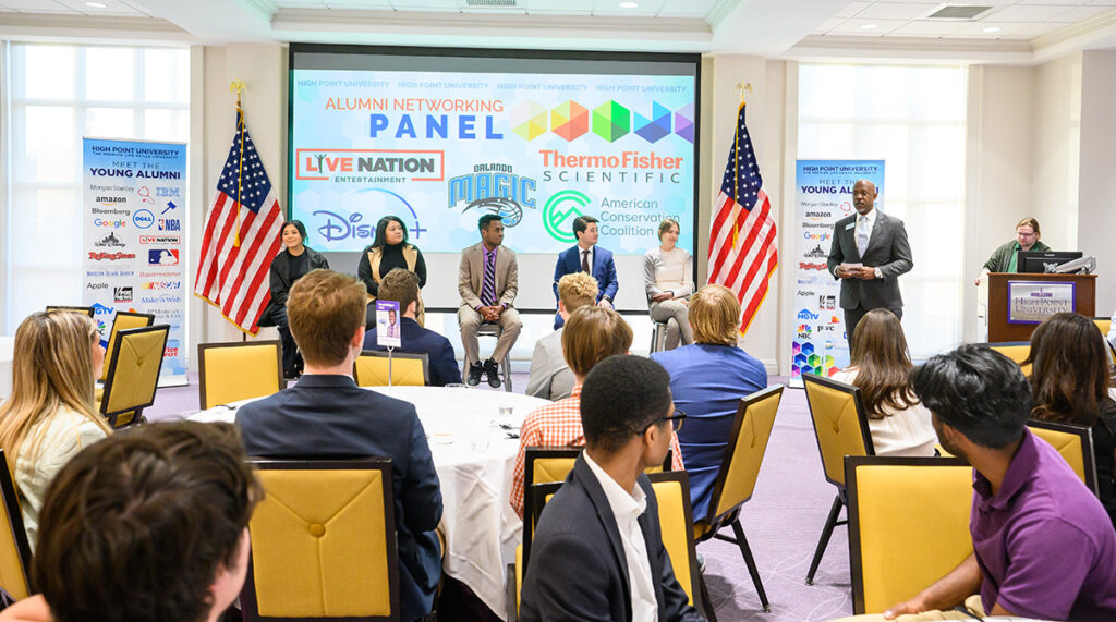 Dr. Doug Hall, vice president for career and professional development, is pictured at right as he moderated a young alumni networking panel discussion.