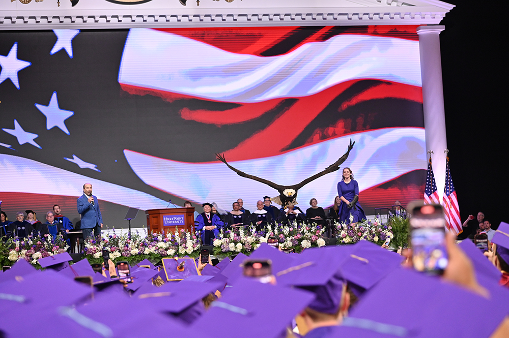 As is tradition at HPU’s graduation, a bald eagle named Clark soared over the graduates at the end of the ceremony to symbolize the ideals of free enterprise, independence and the ability to pursue new opportunities in America. He flew over the arena as Greenwood performed “God Bless the USA.” 
