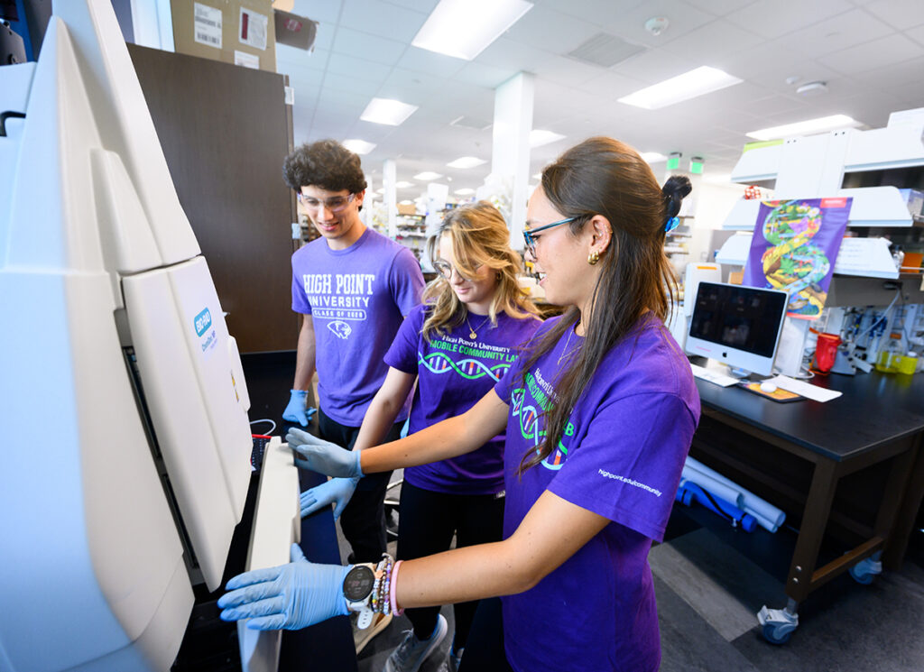 Sophomore biology majors Tyler Janick and Jordan Havert work in the lab researching fungi with Shauna Skow, a senior biology major.