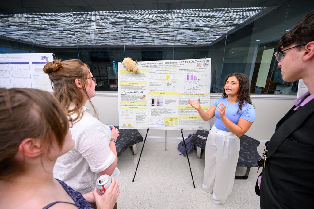 Attendees listened as Gabriella Orecchio, a sophomore biochemistry major from Weirton, West Virginia, presented her research about proteins that can survive extreme conditions.