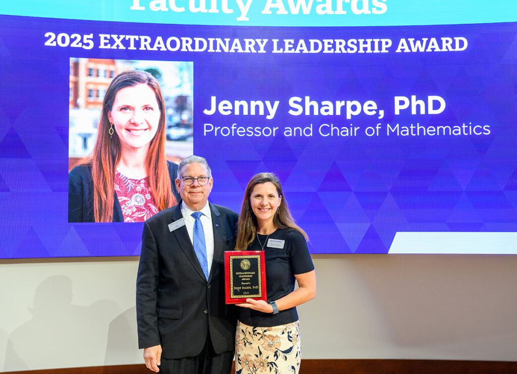 Dr. Daniel Erb, provost, presented the Extraordinary Leadership Award to Dr. Jenny Sharpe, professor and chair of the Department of Mathematical Sciences.