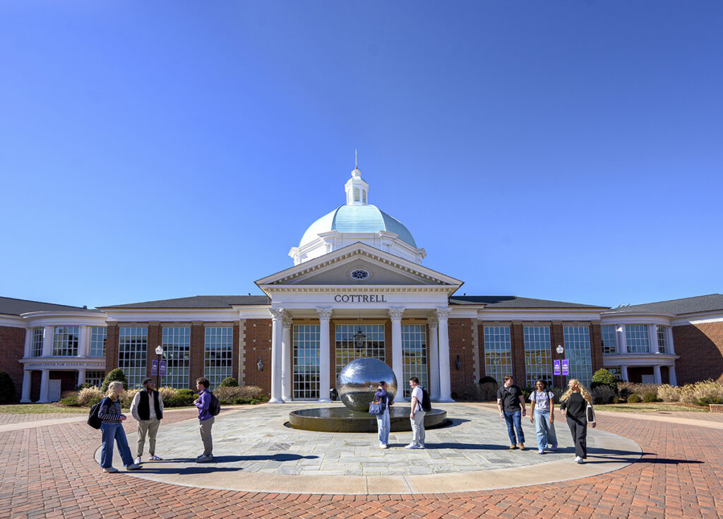 Students gathered on campus outside Cottrell Hall.