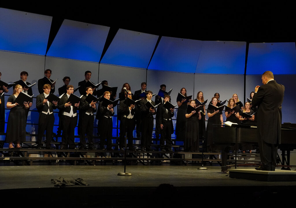 Dr. Marc Foster, chair of the music department, directed a choral concert at Fall Family Weekend.
