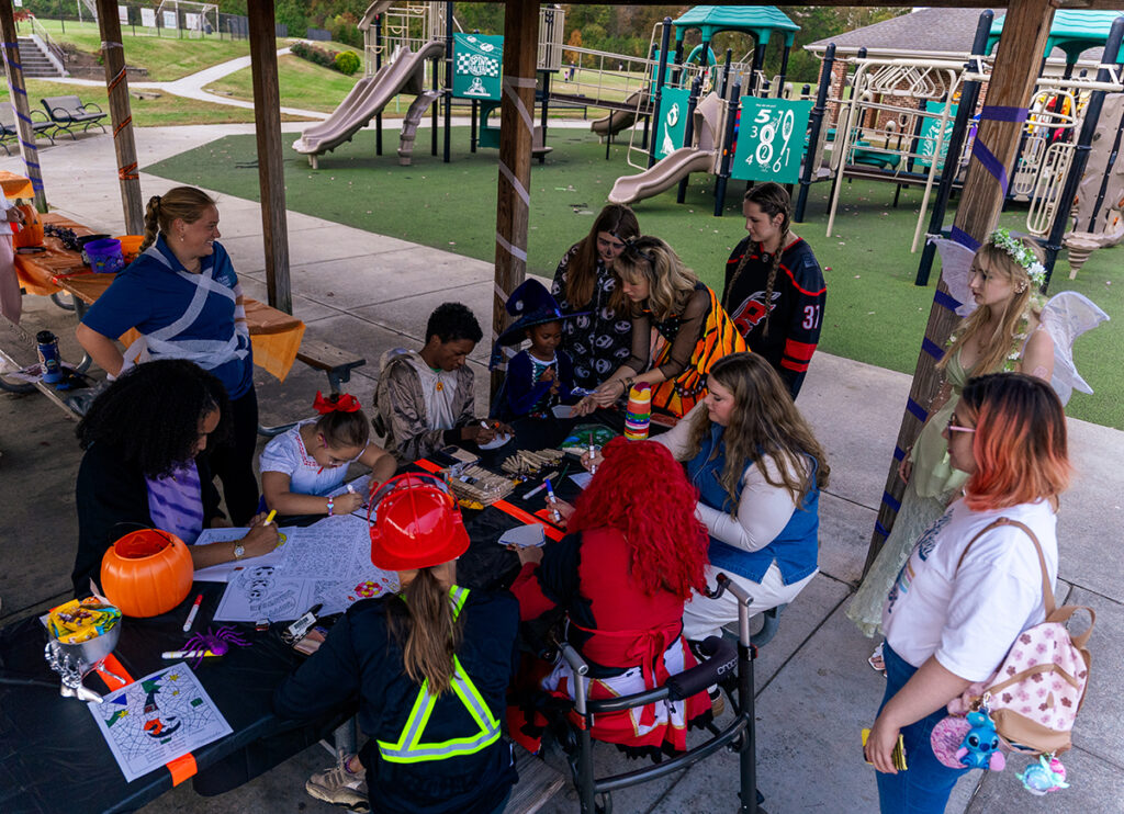 HPU students assisted individuals with intellectual and physical disabilities to enjoy games, crafts and food in Halloween-themed areas during the event.