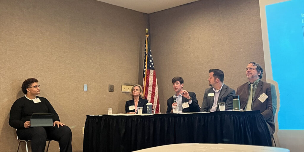 From left, moderator Moller observed panelists Echols, Kifer, Hall and Brophy as they discussed “Putting AI into Practice.”