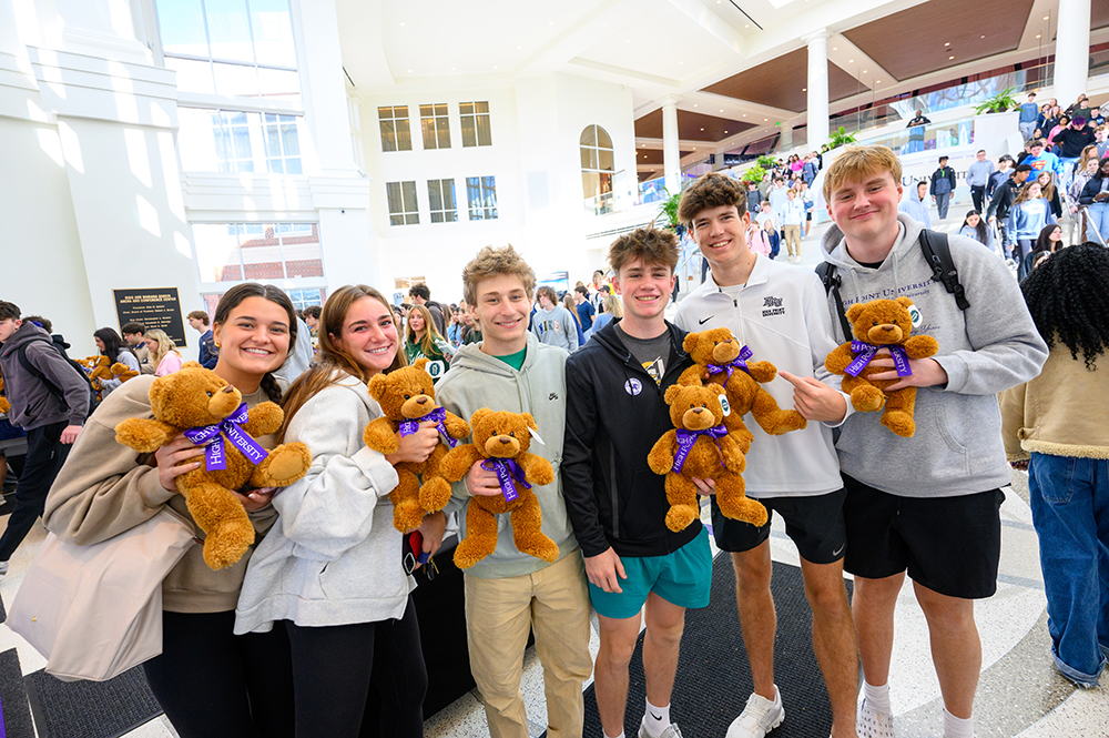 A group of freshmen posed with their teddy bears.