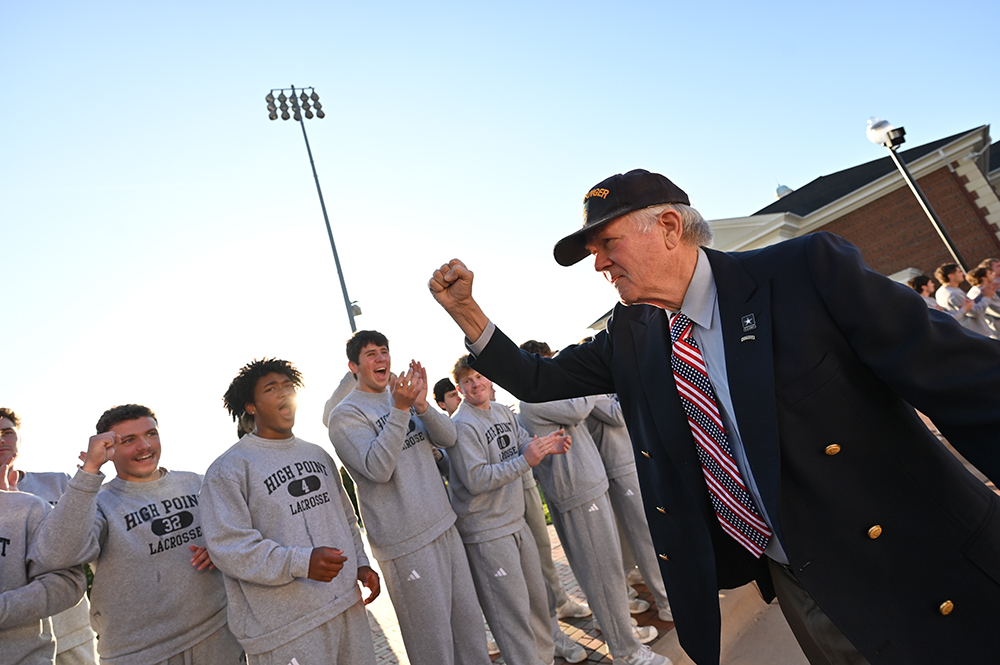 HPU lacrosse team members were among the students who celebrated with veterans as they entered the arena.