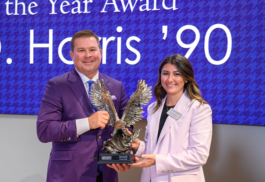 Jeffrey D. Harris received the Alumni of the Year Award, presented by Elizabeth Boles, senior director of alumni engagement.