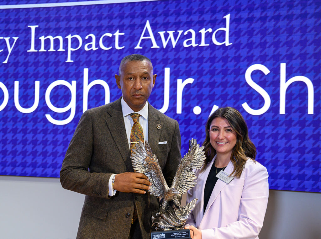 Forsyth County Sheriff Bobby F. Kimbrough Jr., Class of 1991, received the Community Impact Award from Boles.