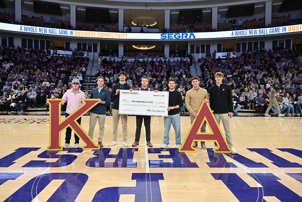 Members of HPU’s Kappa Alpha Order fraternity presented a check for $75,000 to The Independence Fund during the basketball game. The gift will provide a $50,000 fund to send wounded veterans and their families on vacation, as well purchase a Track Chair for wounded Vietnam War Veteran Richard Hughes, who attended the basketball game with the fraternity brothers.
