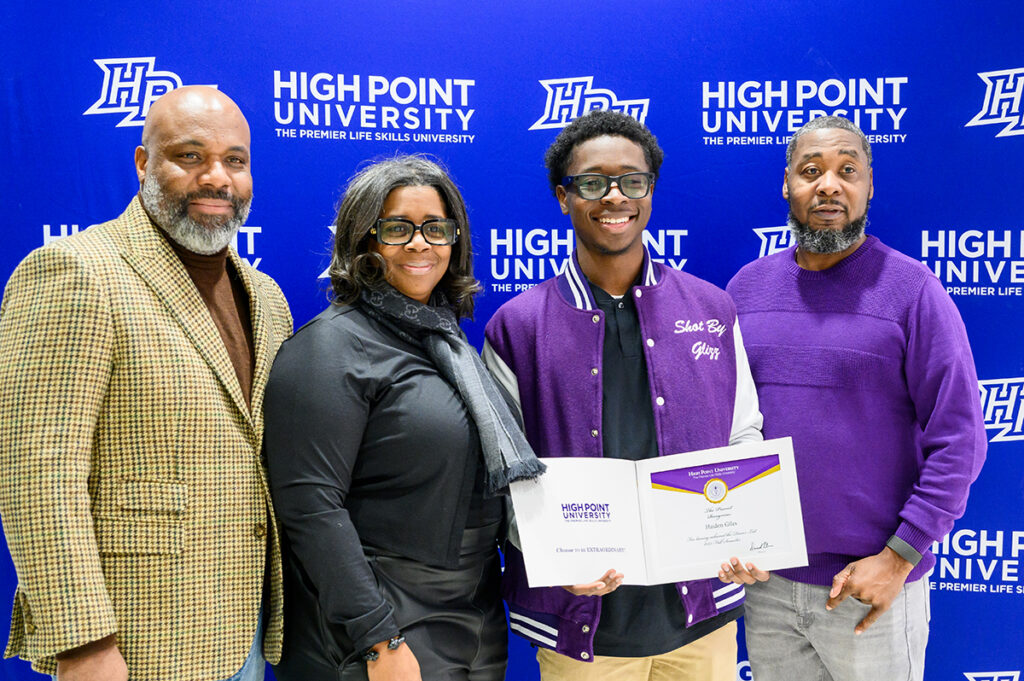 Parents posed proudly with students who earned Dean’s List certificates.