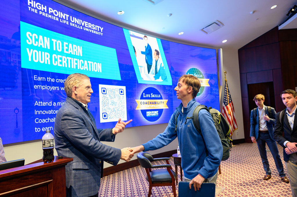 Freeman shook a student’s hand while speaking to him in the Callicutt Life Skills Theater.