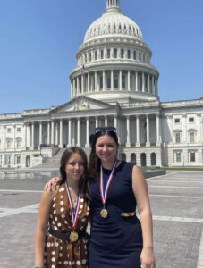 Meagan Kerins, a junior fashion merchandising major, recently earned the Congressional Award Gold Medal. She is pictured at right with her younger sister, Catherine Kerins, at the U.S. Capital Building in Washington, D.C.