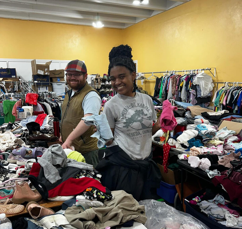 HPU students Thomas Owens and Zaria Owens helped organize a closet during their pilgrimage.