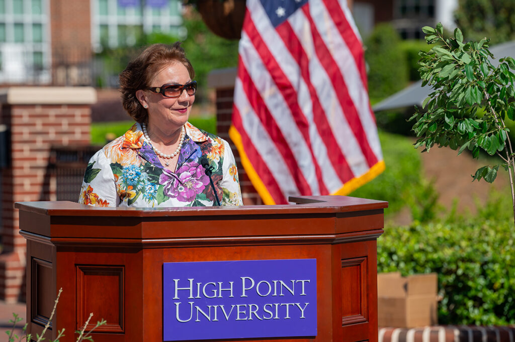 HPU First Lady Mariana Qubein, who has spearheaded the efforts to grow and sustain the campus gardens and arboretum, welcomes audience members.