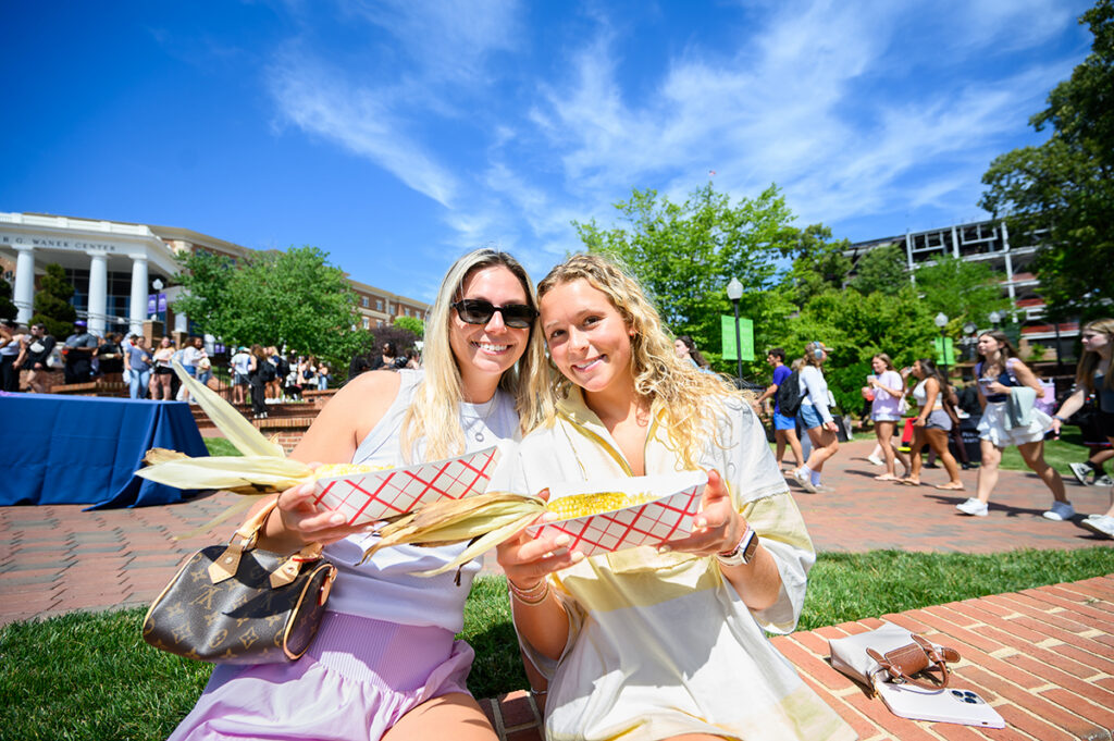 Grace Mitchell, a sophomore health and wellness major from Lake Norman, North Carolina, and Tess Bergey, a sophomore fashion merchandising major from Buck’s County, Pennsylvania, smiled as they enjoyed roasted corn during the Earth Day celebration.