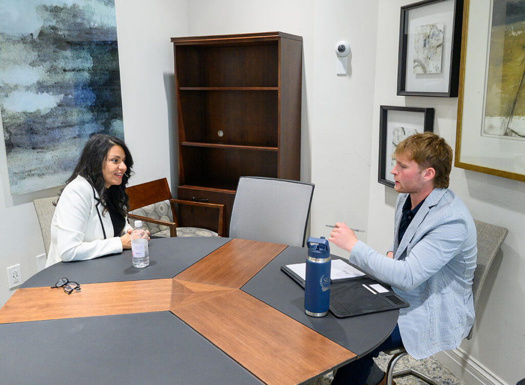 Patiri conducted a one-on-one executive coaching session with Brady Durkin, a junior media and film production major, in Cottrell Hall’s Sales Learning Lab.